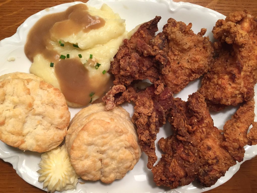Frank’s Oyster House & Champagne Parlor in Ravenna makes some of Seattle’s best buttermilk-brined fried chicken, served with Robuchon-inspired potato puree, gravy, buttermilk biscuits and honey butter. (Bethany Jean Clement / The Seattle Times)