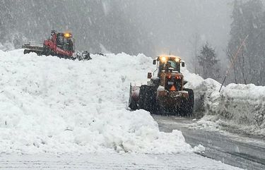 WSDOT crews and a Stevens Pass ski area groomer work at clearing HWY 2 after avalanche control Monday, Feb. 22, 2021. There were several other natural slides along the pass this morning after WSDOT closed the pass overnight.