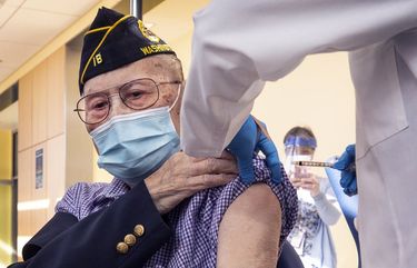 Tuesday, Feb. 23, 2021    Gene Moy, Army Veteran from 1941 to 1945 at 103-years-old is thought to be oldest living Chinese American Veteran.  Today Moy received his  second dose of COVID-19 vaccine at the Seattle VA Puget Sound Health Care Hospital.  “I feel like a movie star” said Gene as cameras clicked away.   216465