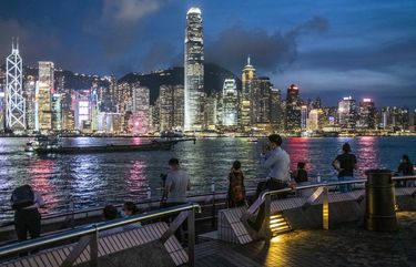 People take in the view of the Hong Kong skyline from an overlook on May 29, 2020.  (Lam Yik Fei / The New York Times)