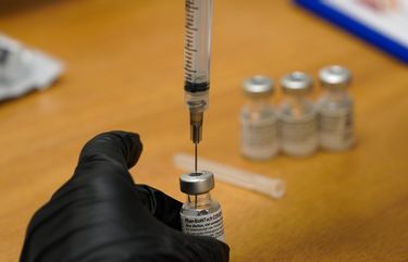 FILE – In this Feb. 12, 2021, file photo, scripps health official draws from a vile of the COVID-19 vaccine prior to administering it at their new drive-thru vaccination site at the Del Mar Fairgrounds in Del Mar, Calif. Executives from the major COVID-19 vaccine producers are set Tuesday, Feb. 23, to answer questions from Congress about expanding the supply of shots needed to curb the pandemic that has killed more than 500,000 Americans. (Nelvin C. Cepeda/The San Diego Union-Tribune via AP, Pool, File) CADIU201 CADIU201