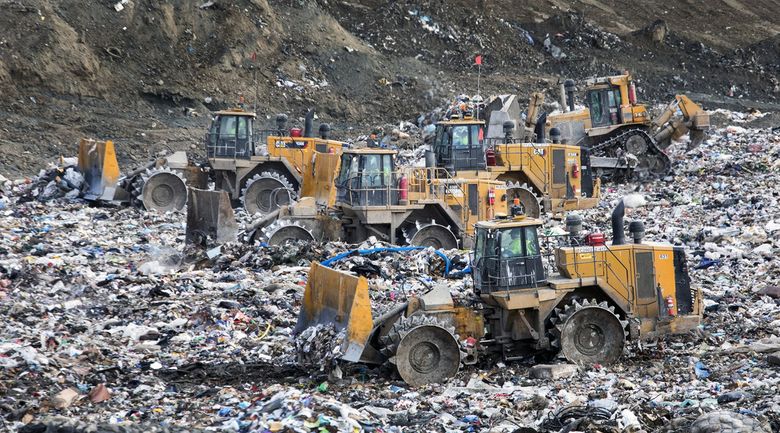 Each day more than 12 million pounds of garbage is dumped, spread, compacted and finally covered with a layer of dirt at the Klickitat County landfill owned by Republic Services. It sits on a plateau above the Columbia River in Southern Washington.  (Steve Ringman / The Seattle Times)