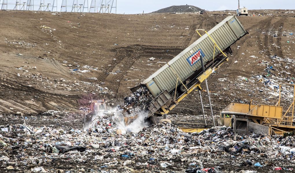 A container of garbage slides into the Republic Services landfill, which is permitted to cover —over time — as much as 915 acres in Southern Washington’s Klickitat County. (Steve Ringman / The Seattle Times)