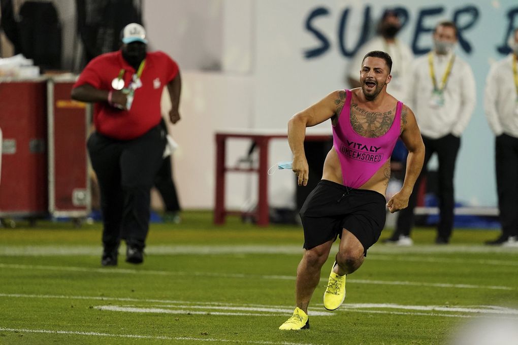 A fan runs on the field during the second half of the Super Bowl between the Tampa Bay Buccaneers and the Kansas City Chiefs, on Sunday in Tampa, Fla. The Tampa Bay Buccaneers defeated the Kansas City Chiefs 31-9. (Steve Luciano / The Associated Press)