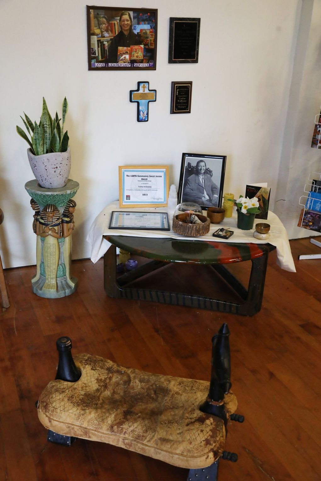 An altar for late owner Vickie Williams is seen inside the LEMS Cultural Center and Bookstore for Life Enrichment in Seattle’s Columbia City neighborhood, Feb. 22, 2021. Williams was a community steward in addition to running LEMS, Seattle’s only black-owned bookstore. (Ken Lambert / The Seattle Times)