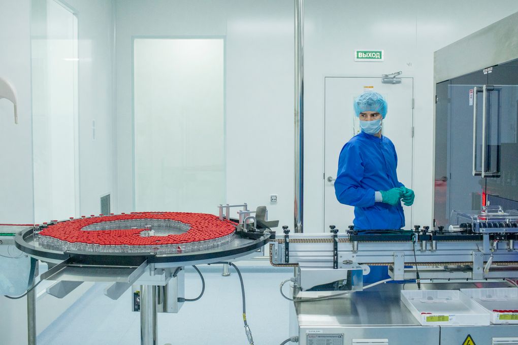 An employee oversees a Sputnik V vaccine production line operated by a contractor, the pharmaceutical company Biocad, in Saint Petersburg, Russia, Feb. 17, 2021. Russia has earned plaudits by sharing its vaccine with countries around the world, but production is lagging. (Sergey Ponomarev/The New York Times)