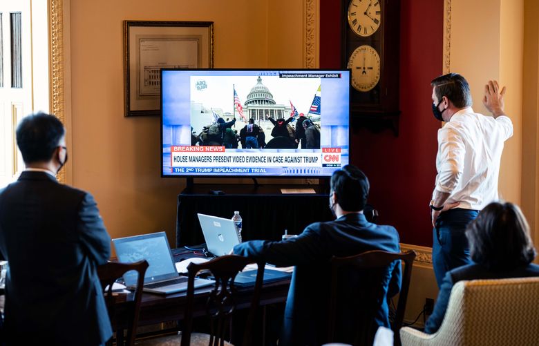 Several of the House impeachment managers watch the prosecution’s display of videos from Jan. 6 during the trial at the Capitol on Tuesday, Feb. 9, 2021. As the U.S. Senate opened an unprecedented second impeachment trial of former President Donald Trump, the powerful video images of last month’s deadly assault on the Capitol made abundantly clear how different this proceeding will be from the first. (Erin Schaff/The New York Times)
