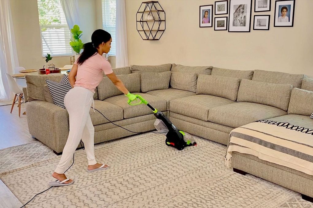 Jessica Tull vacuums her living room and the world can watch on YouTube. Some of her “Clean with Me” videos have attracted more than three million views. (Courtesy of Jessica Tull and Ruby Tull)