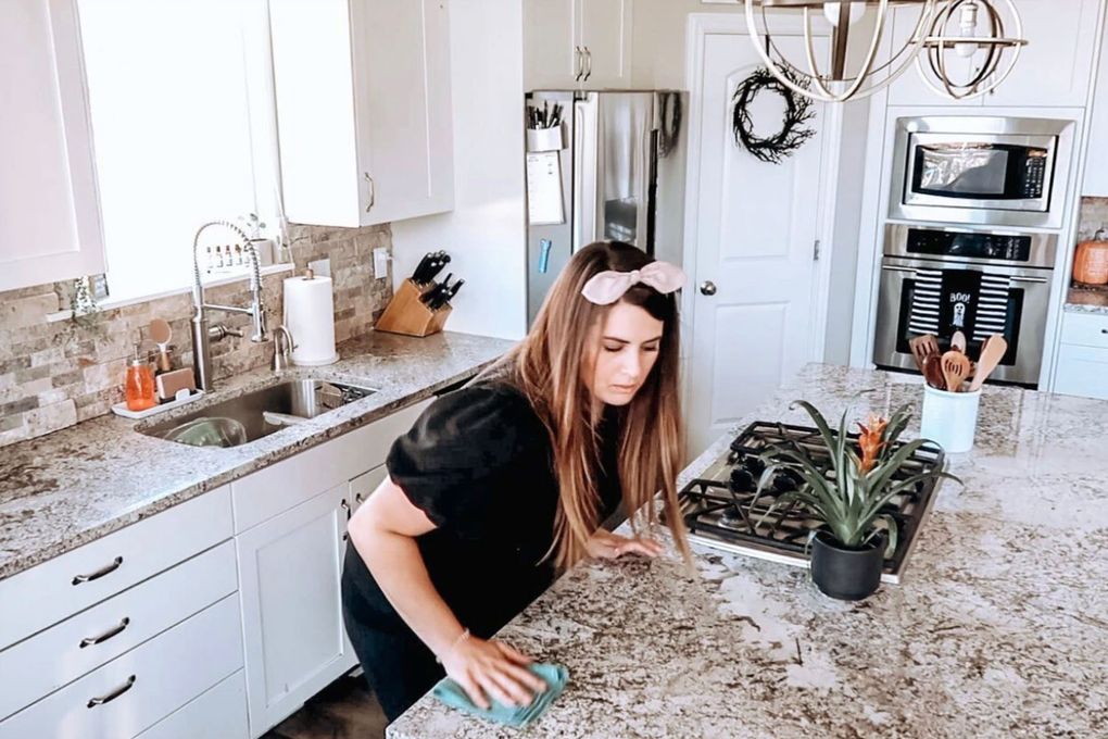 Amanda Paige scrubs her kitchen island on one of the cleaning videos posted to “This Crazy Life,” her YouTube channel with almost 300,000 subscribers. (Courtesy of Amanda Paige)