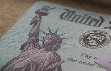 A stimulus check issued by the IRS to help combat the adverse economic effects of the COVID-19 outbreak in January 2021. (AP Photo/Eric Gay)