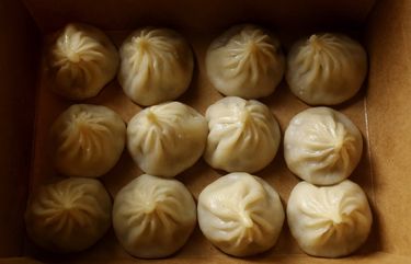 Soup dumplings are seen in a carryout box at XCJ (Xiao Chi Jie) Monday, May 18, 2020 in Bellevue. 213958