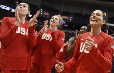 United States’ Sue Bird, right, with Breanna Stewart, left, and Katie Lou Samuelson at the end of an exhibition basketball game, Monday, Jan. 27, 2020, in Hartford, Conn. (AP Photo/Jessica Hill)