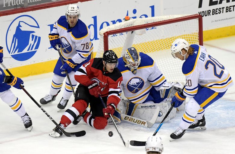 Buffalo Sabres goaltender Linus Ullmark (35) gloves the puck as