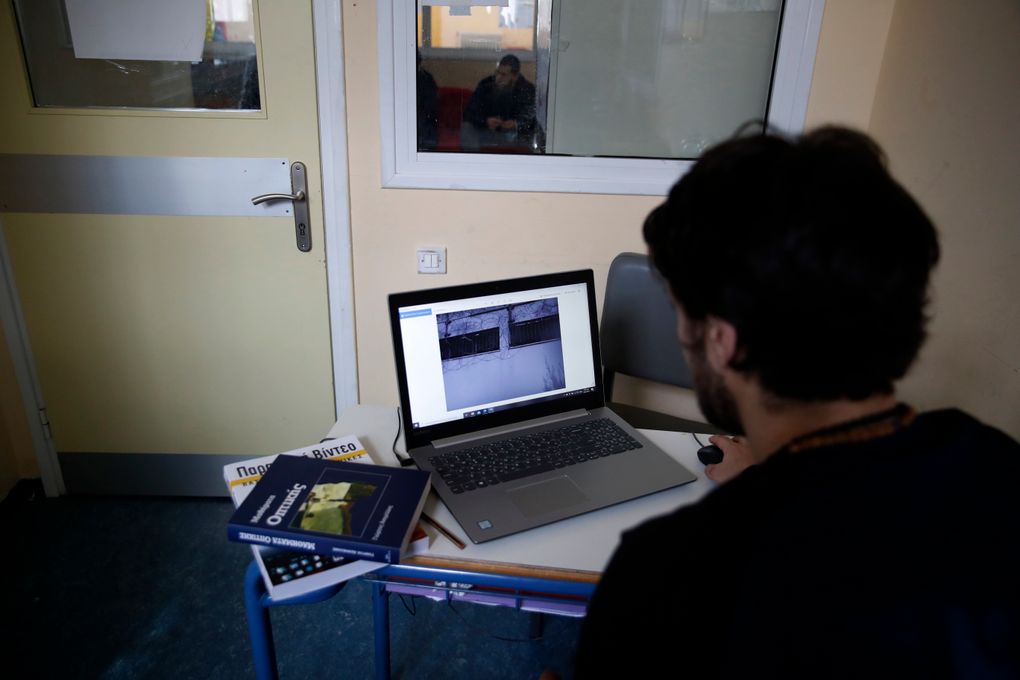 An inmate checks a photo before taking online exams for his university exams photography and audiovisual arts course, at Avlona’s prison school, north of Athens, Wednesday, Feb. 10, 2021. With Greece’s schools shut due to the pandemic, all lessons have gone online. But the online world isn’t within reach of everyone _ and particularly not within reach of the students of Avlona Special Youth Detention Center, where internet devices are banned by law from the cells. (AP Photo/Thanassis Stavrakis)