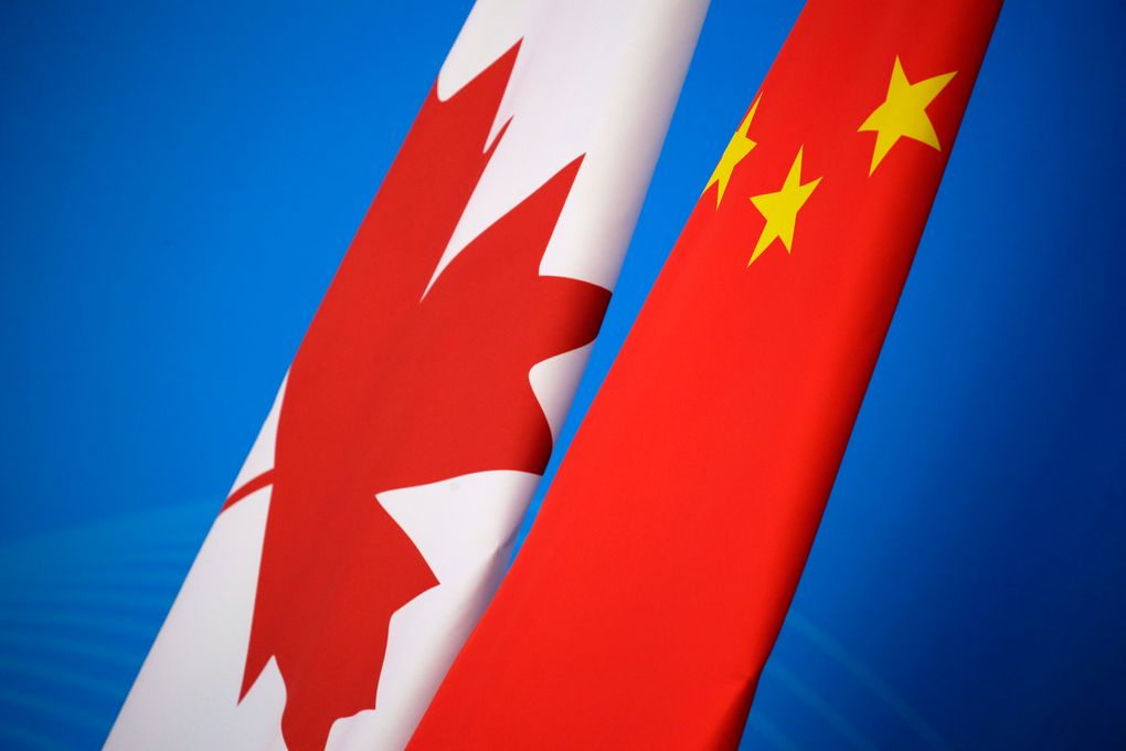 Flags of Canada and China are placed for the first China-Canada economic and financial strategy dialogue in Beijing, China. China says it has lodged a formal complaint with Canada over T-shirts ordered by one of the country’s Beijing Embassy staff that allegedly mocked China’s response to the coronavirus outbreak. (Jason Lee/Pool Photo via AP, file)