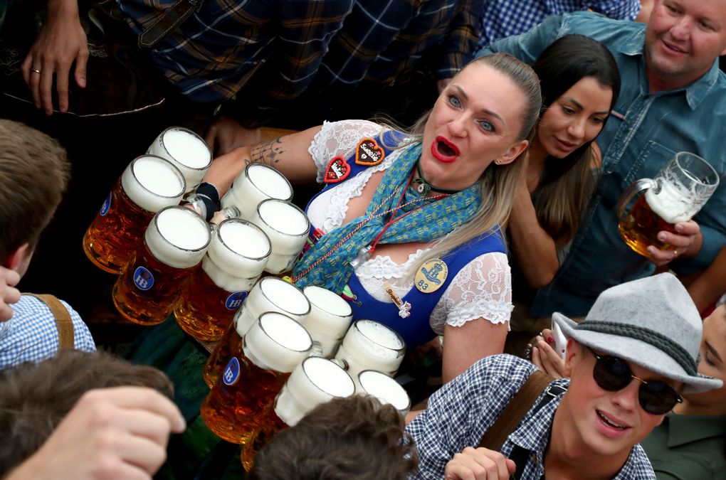 FILE – In this Saturday, Sept. 21, 2019 file photo, a waitress holds twelve glasses of beer during the opening of the 186th ‘Oktoberfest’ beer festival in Munich, Germany. Official data show that beer sales in Germany were down 5.5 percent last year, dragged lower by lengthy closures of bars and restaurants in the coronavirus pandemic. (AP Photo/Matthias Schrader, file)