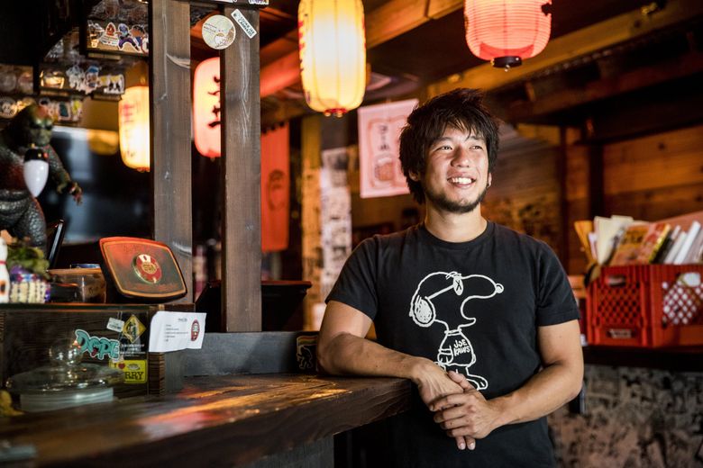 Chef Shota Nakajima at his new but temporarily closed bar, Taku, on May 29, 2020 — he opened it five days before the dining-in shutdown last March, just the beginning of a series of dramatic ups and downs during a year of COVID-19 life. (Amanda Snyder / The Seattle Times)
