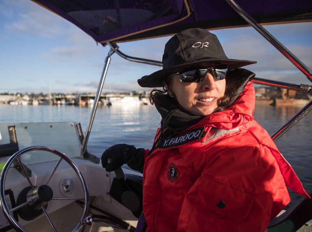 The University of Washington women’s crew coach Yaz Farooq and her team row in Lake Union in 2018. (Mike Siegel / The Seattle Times, file)
