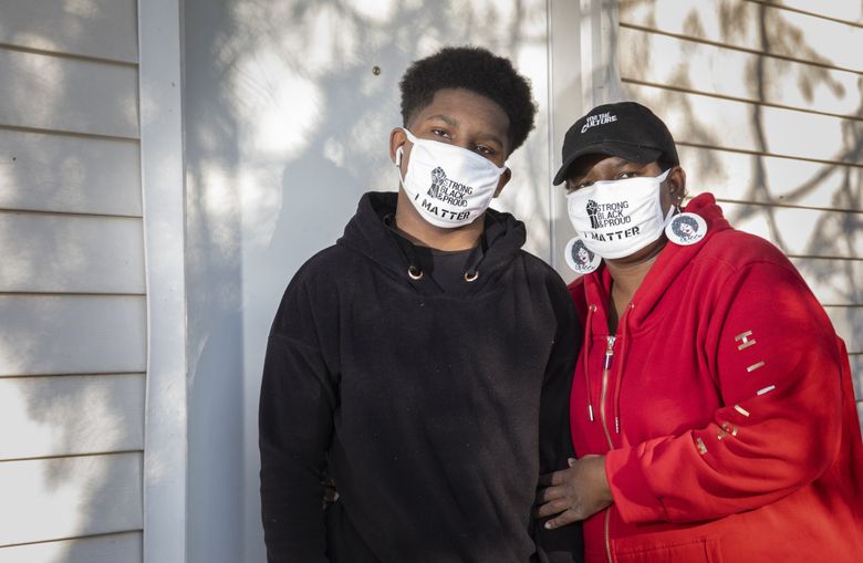 Jacquetta McGowen is looking for reasons to send her 14-year-old son back to school when it reopens. But concerns about physical safety and past incidents of racism, she said, put that in doubt: “The negative is winning.” (Ellen M. Banner / The Seattle Times)