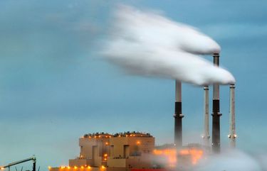 The Colstrip power plant  in southeast Montana employs about 360 people and is partially owned by Puget Sound Energy (PSE). The plant consists of four separate units, each with its own boiler that collectively can produce 2094 megawatts of energy. The two oldest units are scheduled to close by 2022, a decision spurred by the plant‚Äôs difficult economics and a push toward cleaner energy. Castle Rock Lake in the foreground supplies water for the power plant and the city of Colstrip. 
 Photographed on December 6, 2017. 204974 204974