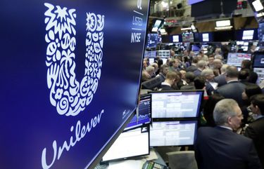 FILE – In this Thursday, March 15, 2018 file photo, the logo for Unilever appears above a trading post on the floor of the New York Stock Exchange.  Consumer products giant Unilever, said Thursday July 23, 2020, that second-quarter sales were only slightly lower than the same period a year ago despite the lockdown measures triggered by the global fight against the coronavirus.(AP Photo/Richard Drew, File) WRC107