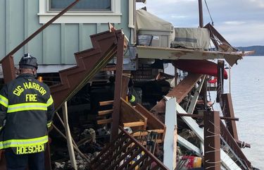 A barge struck three homes in Gig Harbor on Monday, March 14, 2021.