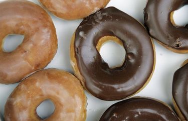 **  FILE ** In this  April 17, 2008 file photo, Krispy Kreme doughnuts are shown in Matthews, N.C.  Krispy Kreme’s signature glazed doughnuts may be best hot, but its sales have been anything but in recent years. Now the chain is hoping that going cold _ with its new soft-serve ice cream _ will be the catalyst it needs. (AP Photo/Chuck Burton) NCCB102