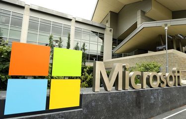 FILE – In this July 3, 2014, file photo, the Microsoft Corp. logo is displayed outside the Microsoft Visitor Center in Redmond, Wash.  (AP Photo/Ted S. Warren, File) FX102
