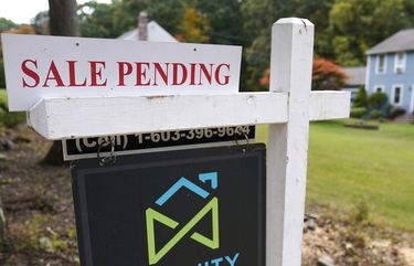 FILE – In this Sept. 29, 2020 file photo, a sale pending sign is displayed outside a residential home for sale in East Derry, N.H. (AP Photo/Charles Krupa, File)