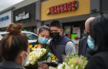 Jami Webb, with her fiancé, Kevin Chen, mourn her mother, Xiaojie Tan, the owner of Young’s Asian Massage, one of three Atlanta-area spas attacked last week in a mass shooting that killed a total of eight people, in Atlanta on March 19, 2021. Owners and employees at the spas attacked last week were immigrants with similar dreams, but were separated by a vast gap in money and power. (Chang W. Lee/The New York Times) XNYT103 XNYT103