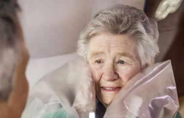 Caterina Salvi, 90, right, looks at her daughter Teresa Carrara through a plastic barrier part of a protective inflatable tunnel at the Martino Zanchi nursing home in Alzano Lombardo, northern Italy, Wednesday, Feb. 24, 2021. The protective tunnel was set up to allow home residents to have personal contact with their families and still stay safe respecting the anti-COVID-19 precautions.