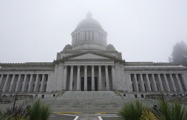 FILE – In this Jan. 7, 2021, file photo, the Legislative Building is shown partially shrouded in fog at the Capitol in Olympia, Wash. Washington state’s richest residents, including Bill Gates and Jeff Bezos, would pay a wealth tax on certain financial assets worth more than $1 billion under a proposed bill whose sponsor says she is seeking a fair and equitable tax code. Under the bill, starting Jan. 1, 2022, for taxes due in 2023, a 1% tax would be levied not on income, but on “extraordinary” assets ranging from cash, publicly traded options, futures contracts, and stocks and bonds. (AP Photo/Ted S. Warren, File)