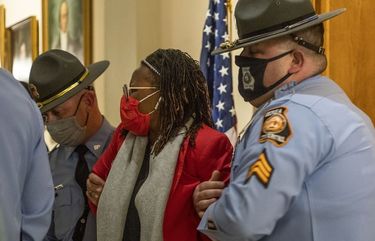 Rep. Park Cannon (D-Atlanta) is placed in handcuffs by Georgia State Troopers after being asked to stop knocking on a door that lead to Gov. Brian Kemp’s office while Gov. Kemp was signing SB 202 behind closed doors at the Georgia State Capitol Building in Atlanta, Thursday, March 25, 2021. (Alyssa Pointer/Atlanta Journal-Constitution via AP) GAATJ211 GAATJ211