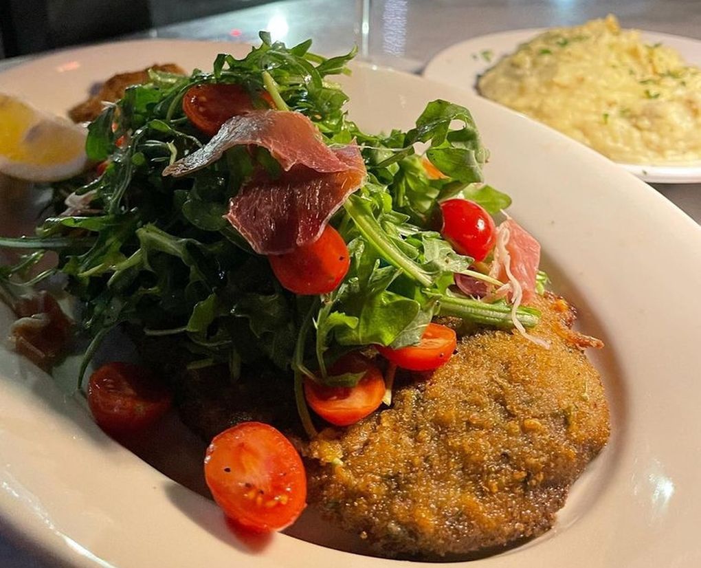 BOCA has opened a second location in Belltown, called BOCA at Queen City Grill. Pictured: its signature beef milanesa primavera with prosciutto and arugula salad. (Courtesy of BOCA)