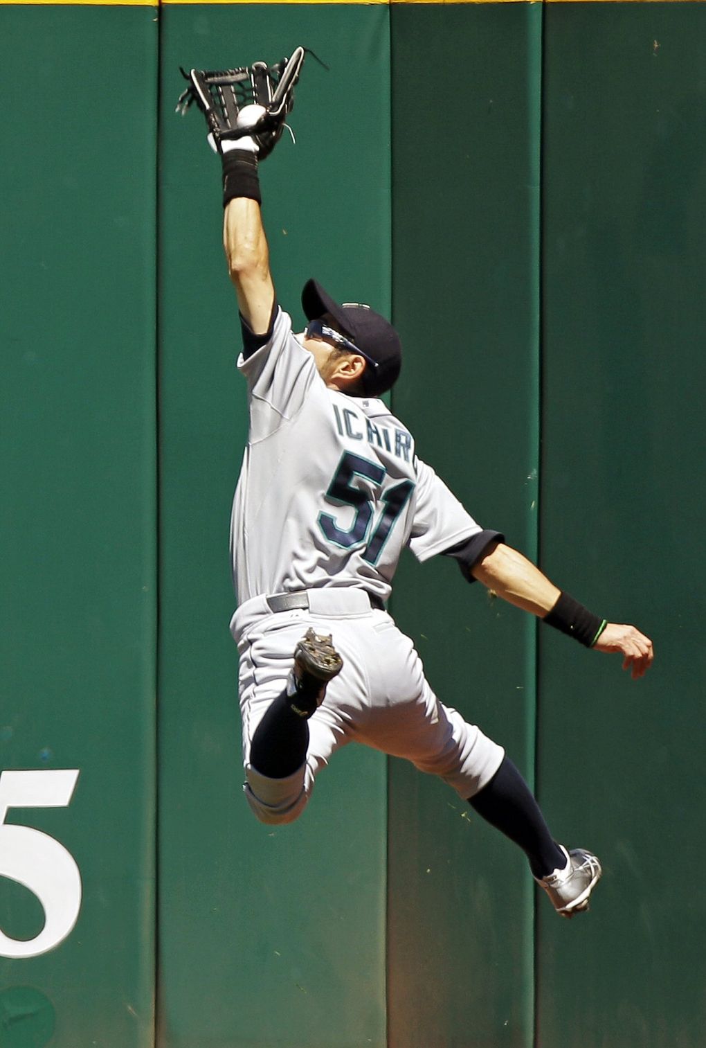 Seattle Mariners right fielder Ichiro Suzuki makes a leaping catch at the wall to rob Cleveland Indians’ Carlos Santana of a hit in the fourth inning of a game in 2012 in Cleveland. (Mark Duncan / The Associated Press)