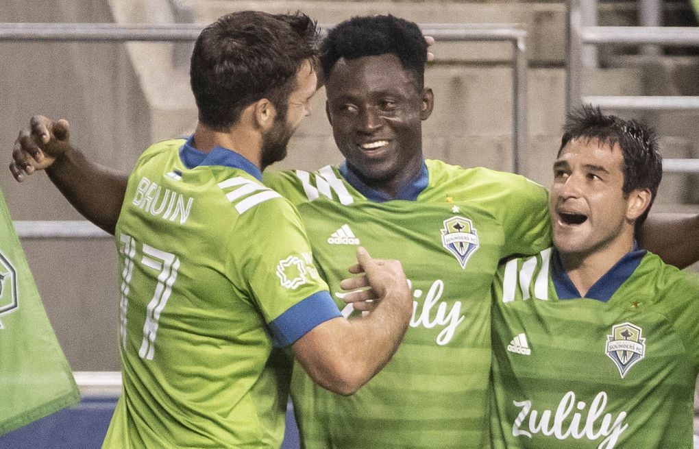 Yeimar Gomez celebrates his second half goal with his Sounders teammates Wednesday night. Real Salt Lake played the Seattle Sounders FC in MLS action Wednesday, October 7, 2020 at CenturyLink Field in Seattle, WA. (Dean Rutz / The Seattle Times)