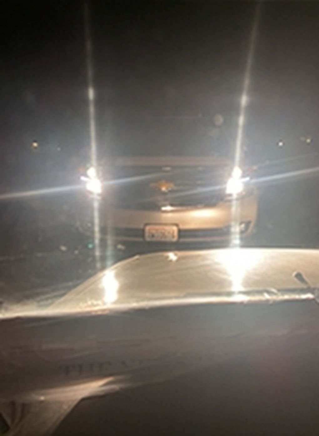 This photo by Sedrick Altheimer the night of his confrontation with Ed Troyer shows Troyer’s SUV and a copy of the News Tribune newspaper on Sedrick’s dashboard. (Sedrick Altheimer)