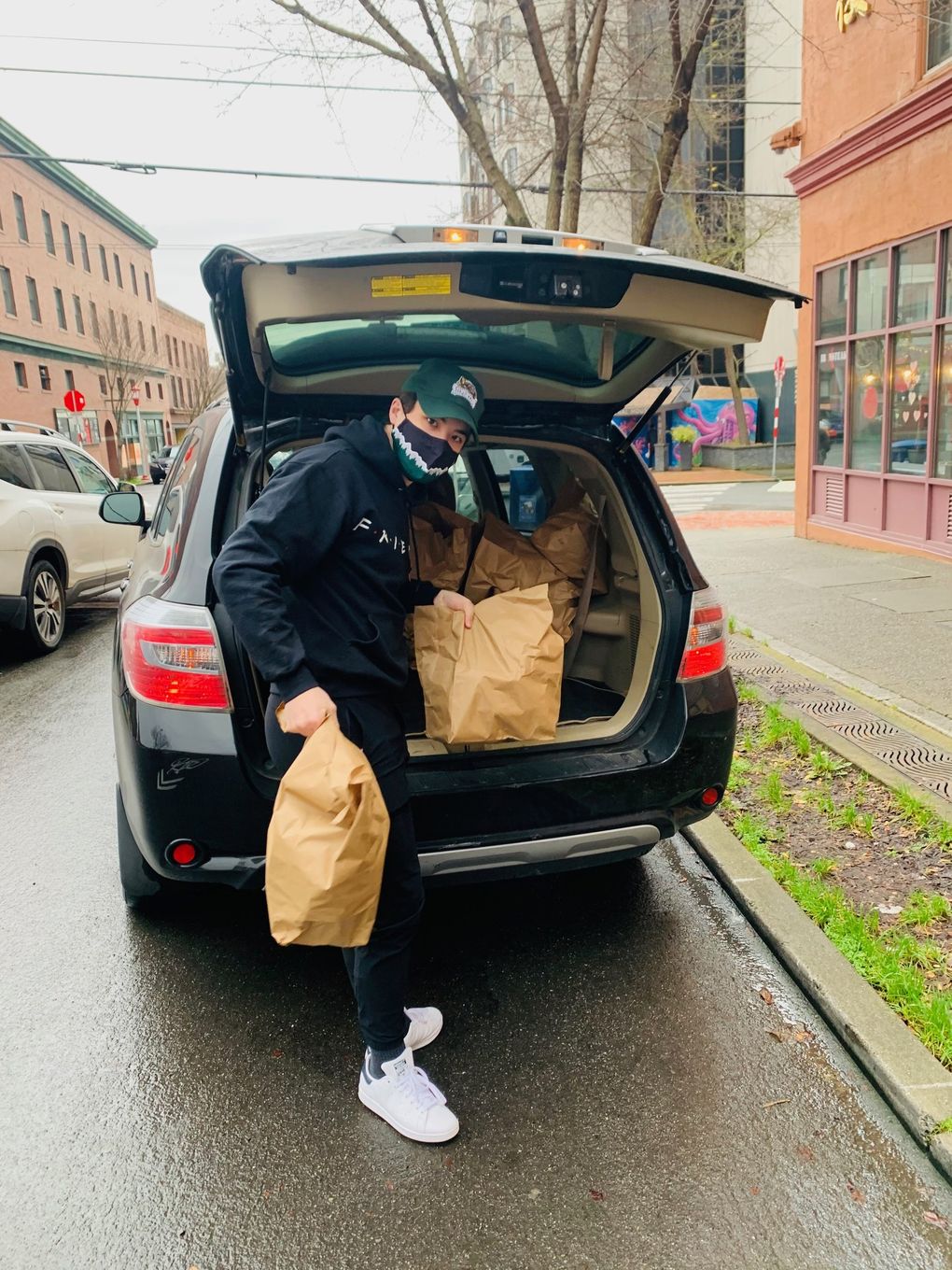 Everett Silvertips forward Brendan Lee delivers groceries last month to elderly residents of Seattle’s International District kept homebound by COVID-19 concerns. (Photo courtesy of the Lee family)