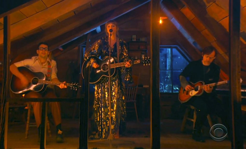 In this video grab provided by CBS and the Recording Academy, Jack Antonoff, from left, Taylor Swift and Aaron Dessner perform at the 63rd annual Grammy Awards at the Los Angeles Convention Center on Sunday, March 14, 2021. (CBS / Recording Academy via The Associated Press)