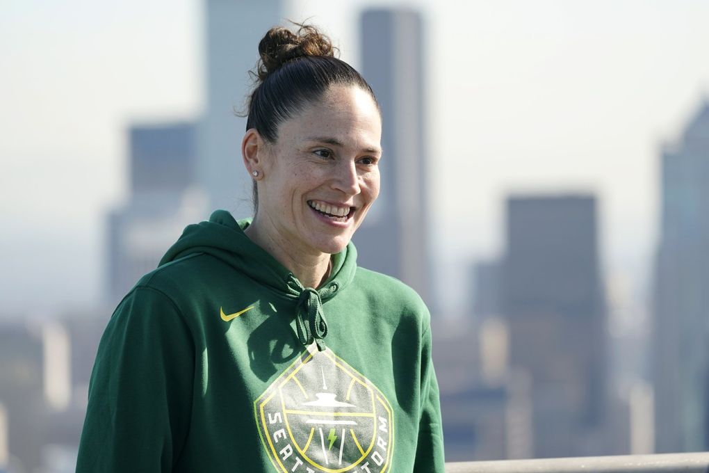 Seattle Storm guard Sue Bird smiles during an interview Wednesday, March 3, 2021, on the roof of the Space Needle in Seattle after she helped raise a flag with the team’s new logo on it. Bird re-signed with the Storm earlier in the week. (AP Photo/Ted S. Warren) WATW115 WATW115 (Ted S. Warren / The Associated Press)