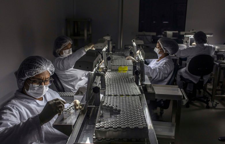 FILE — Doses of China’s CoronaVac vaccine are prepared in São Paulo, Brazil on Feb. 11, 2021. China is a major supplier of coronavirus vaccine, giving it enormous leverage in pandemic-ravaged nations. (Victor Moriyama/The New York Times)