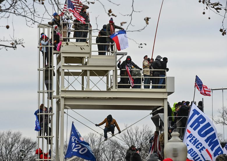 Trump falsely claims Jan. 6 rioters were 'hugging and kissing' police | The  Seattle Times