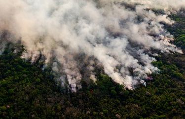 EMBARGO: No electronic distribution, Web posting or street sales before Wednesday 12:01 a.m. ET. No exceptions for any reasons. EMBARGO set by source.** FILE — A wildfire burns through part of the vast Pantanal wetlands in Mato Grosso state, Brazil, Aug. 29, 2020. Tropical forests around the world were destroyed at an increasing rate in 2020 compared with the year before, despite a global pandemic which reduced demand for some commodities that have spurred deforestation in the past (Maria Magdalena Arrellaga/The New York Times) XNYT249 XNYT249