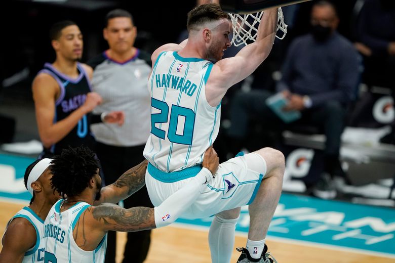 Charlotte Hornets forward Gordon Hayward (20) brings the ball up court  against the Washington Wizards during the first half of an NBA basketball  game in Charlotte, N.C., Wednesday, Nov. 17, 2021. (AP