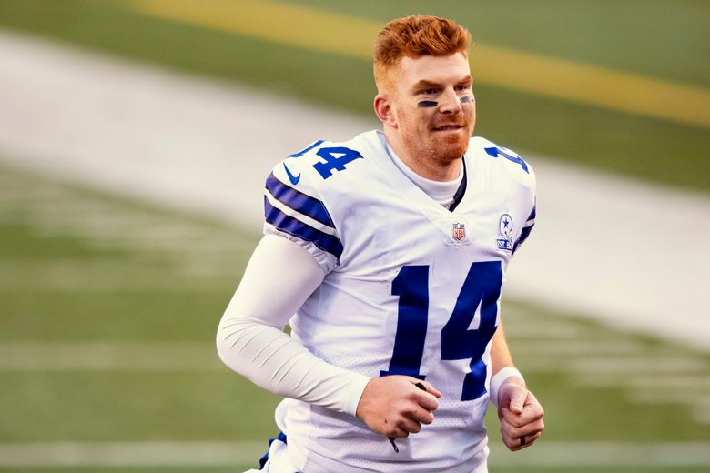 Cincinnati Bengals quarterback Andy Dalton (14) jogs off the field