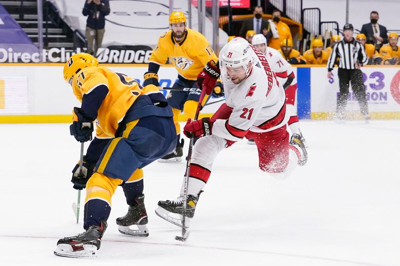 Carolina Hurricanes' Nino Niederreiter (21) shoots the puck in