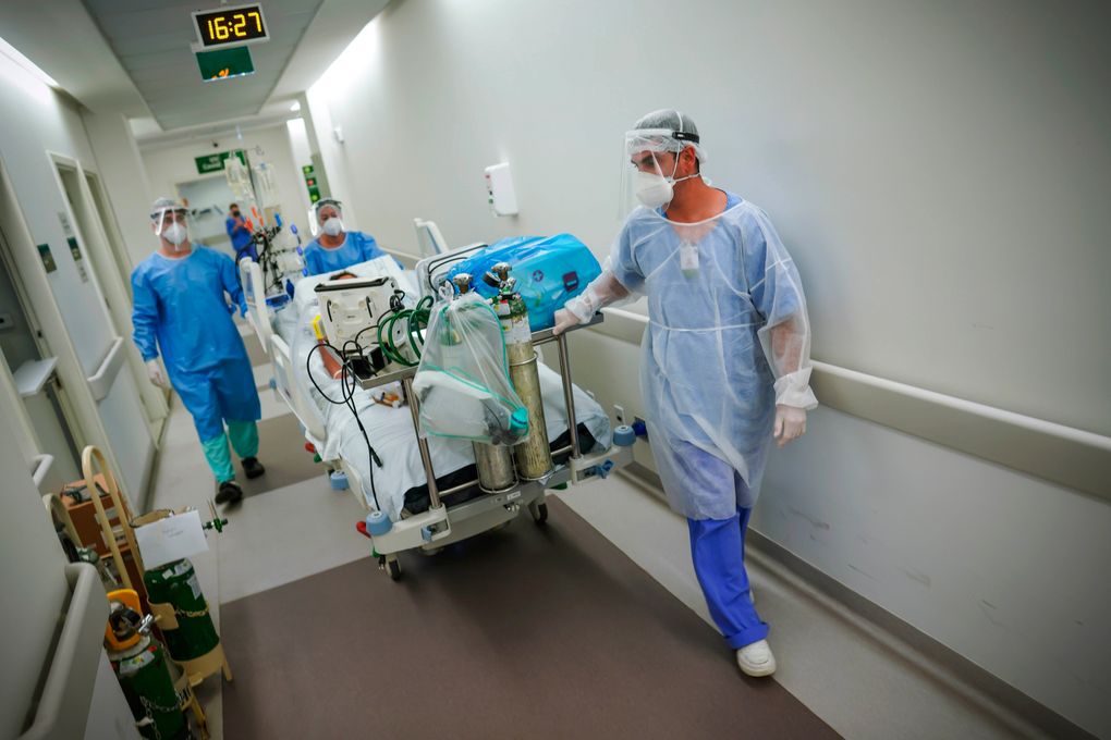 Healthcare workers transport a COVID-19 patient in an intensive care unit at the Hospital das Clinicas in Porto Alegre, Brazil, Friday, March 19, 2021. The P.1 variant, which packs a suite of mutations that makes it more transmissible and potentially more dangerous, is no longer just Brazil’s problem. It’s South America’s problem — and the world’s. (Jefferson Bernardes / AP)