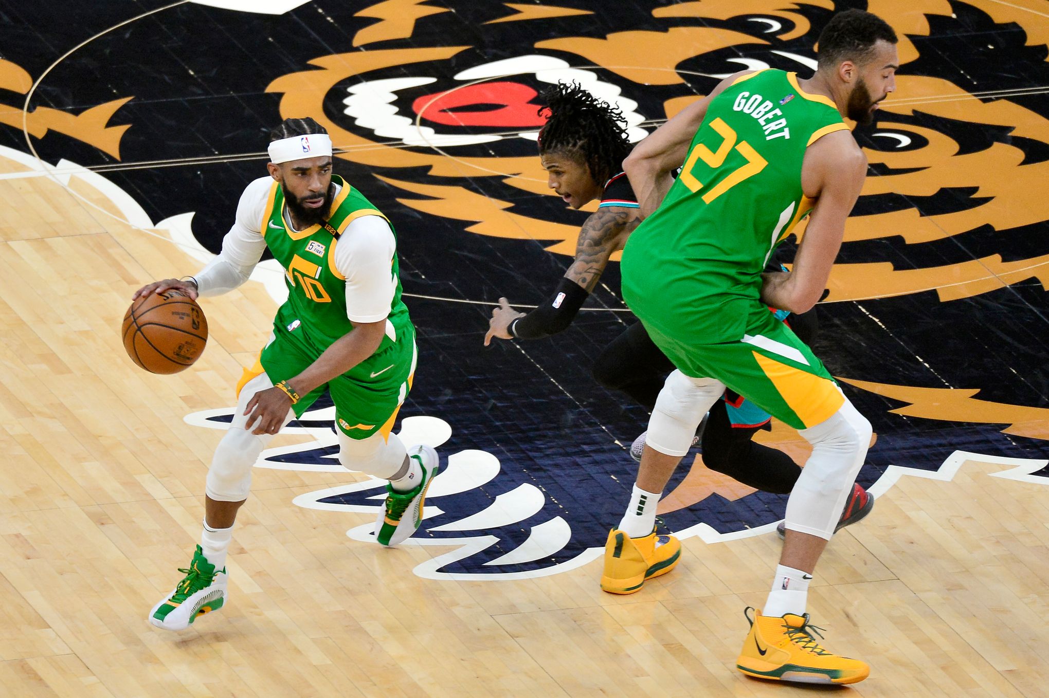 Utah Jazz forward Bojan Bogdanovic (44) celebrates with Mike Conley (10)  during the fourth quarter against the Minnesota Timberwolves in an NBA  basketball game Wednesday, Nov. 20, 2019, in Minneapolis. Utah won