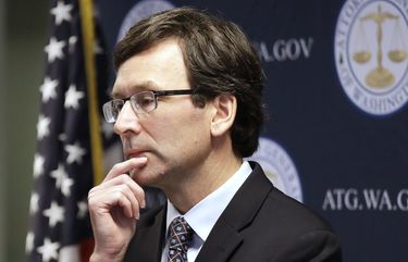 Washington state Attorney General Bob Ferguson looks on during a news conference about his lawsuit challenging a Trump Administration practice of ICE arrests at courthouses Tuesday, Dec. 17, 2019, in Seattle. Washington state has sued the Trump administration over its practice of arresting people at courthouses for immigration violations, saying it interferes with the state’s authority to run its own judicial system. (AP Photo/Elaine Thompson) WAET102