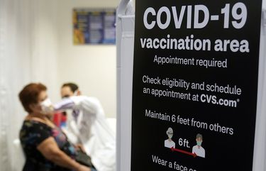 FILE – In this March 1, 2021, file photo, a patient receives a shot of the Moderna COVID-19 vaccine at a CVS Pharmacy branch in Los Angeles. California is expanding its vaccine eligibility to anyone 50 and over starting in April and anyone 16 and over on April 15. Gov. Gavin Newsom said, Thursday, March 25, 2021, that California expects to receive 2.5 million doses a week in the first half of April and more than 3 million a week in the second half of the month. (AP Photo/Marcio Jose Sanchez, File) FX418 FX418